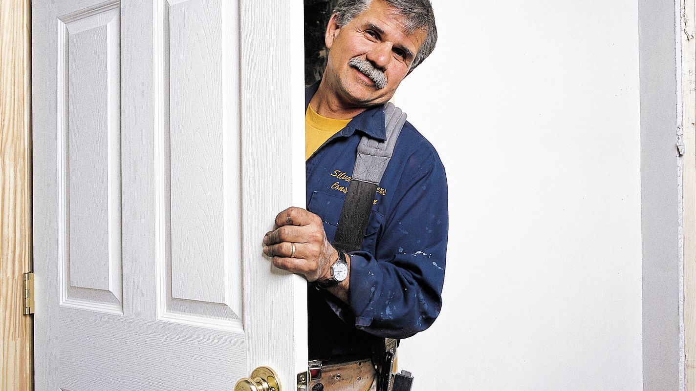 Photo of Tom Silva during the installation process for a prehung door